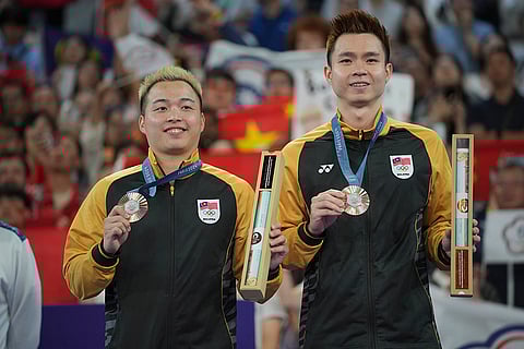 Badminton Men's doubles: Malaysia's Aaron Chia, left, and Soh Wooi Yik after winning bronze medal